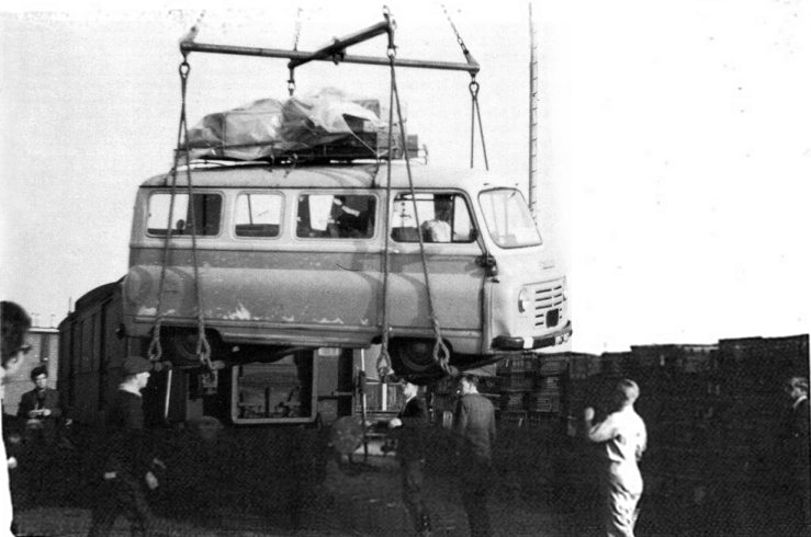 John Lennon looks on as their van is loaded onto the ferry